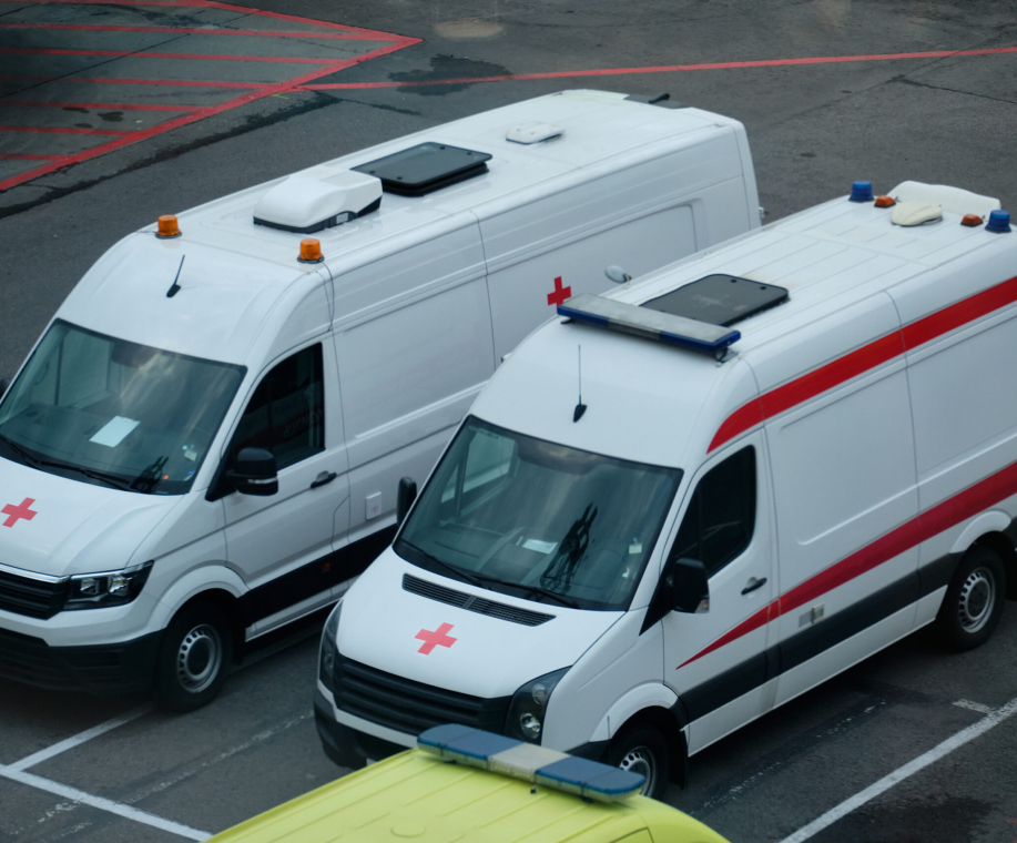 Two white ambulances parked. Medicine service vehicles.
